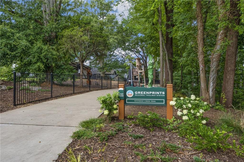 266 Balaban Circle Woodstock, GA 30188 - Photo 40 of 58 a view of a street sign under a large tree