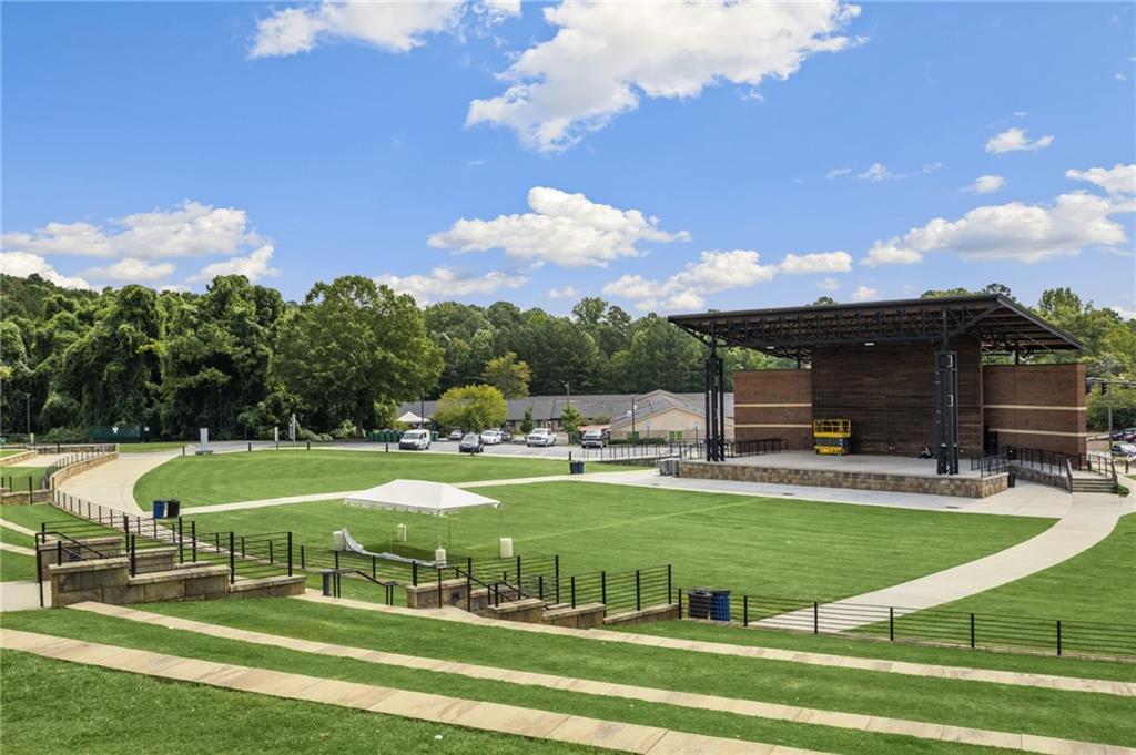 266 Balaban Circle Woodstock, GA 30188 - Photo 42 of 58 a view of a swimming pool with a garden