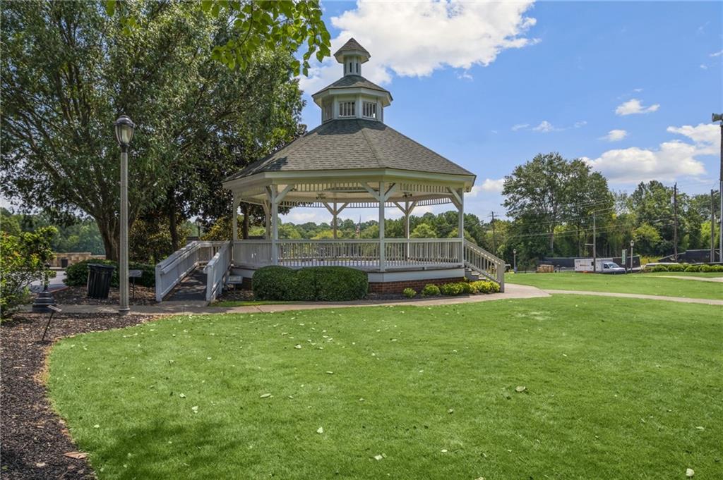 266 Balaban Circle Woodstock, GA 30188 - Photo 43 of 58 a view of a house with a yard