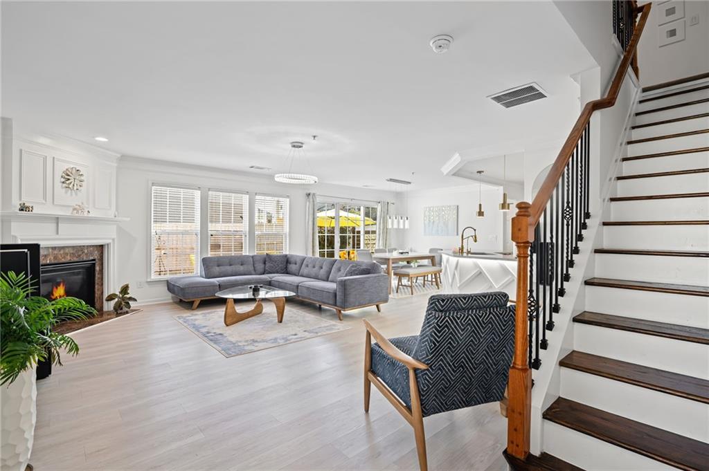 266 Balaban Circle Woodstock, GA 30188 - Photo 5 of 58 a living room with furniture and a fireplace