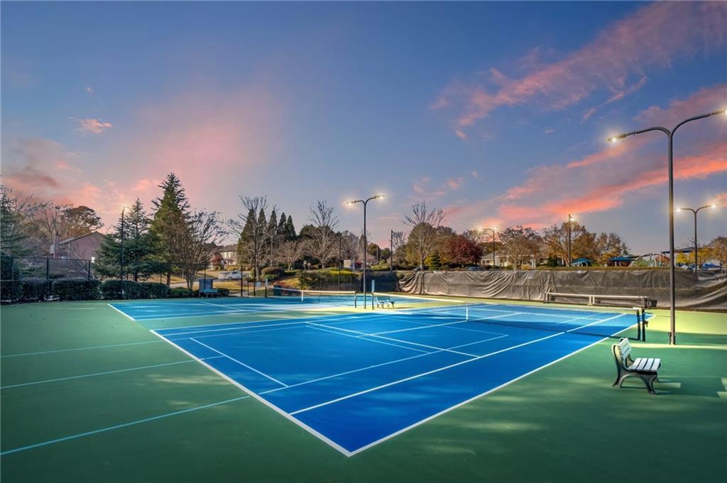266 Balaban Circle Woodstock, GA 30188 - Photo 52 of 58 a view of an outdoor space and tennis court
