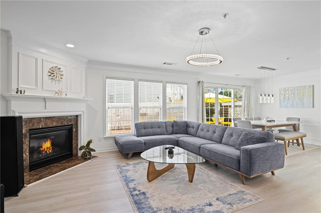 266 Balaban Circle Woodstock, GA 30188 - Photo 6 of 58 a living room with furniture a window and a fireplace