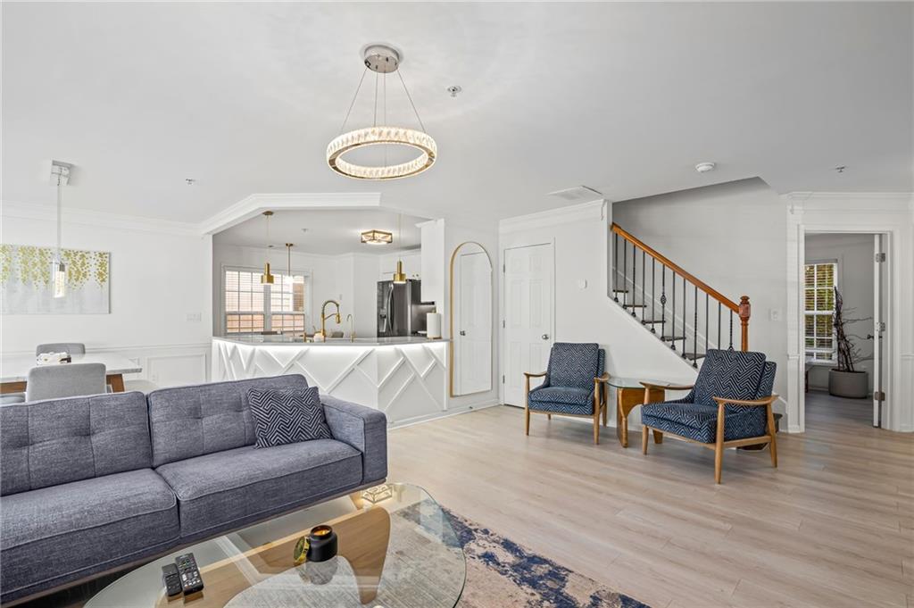 266 Balaban Circle Woodstock, GA 30188 - Photo 9 of 58 a living room with furniture and wooden floor