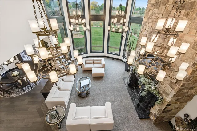 a living room with furniture and a floor to ceiling window