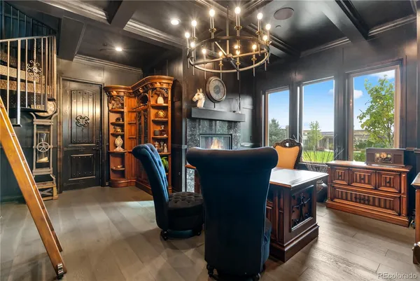 a view of a dining room with furniture chandelier and mountain view