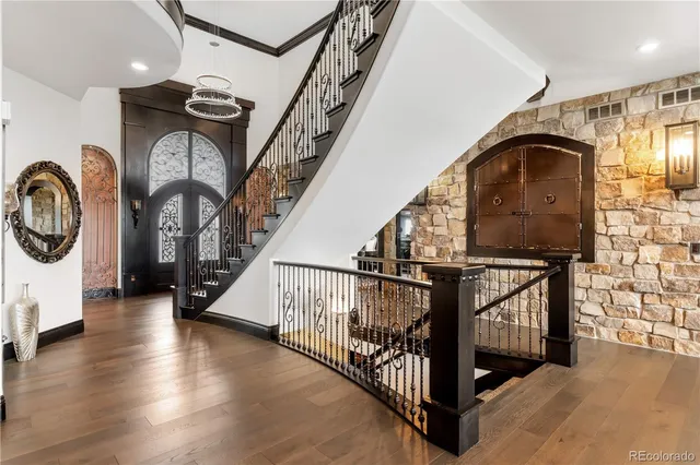 a view of entryway and hall with wooden floor
