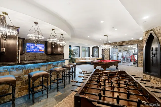 a room with lots of chairs and a flat screen tv