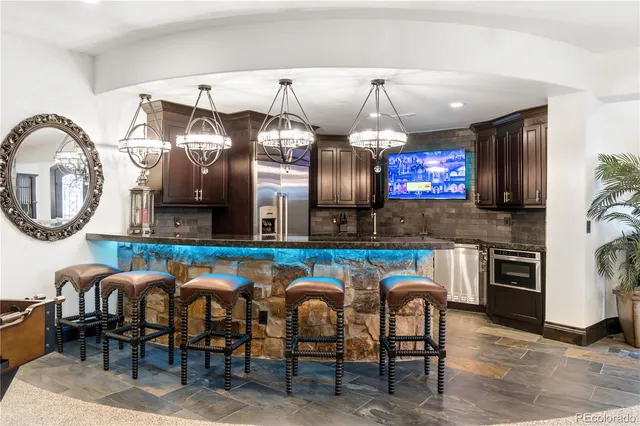 a group of chairs sitting in kitchen and dining room