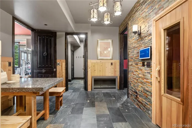 a lobby with furniture and a chandelier