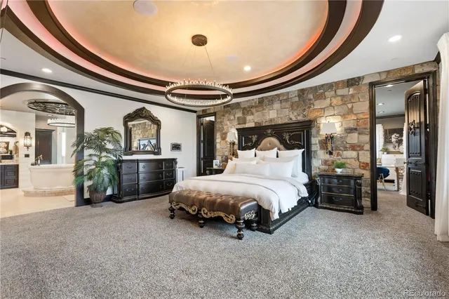 a bed room with a bed and a television