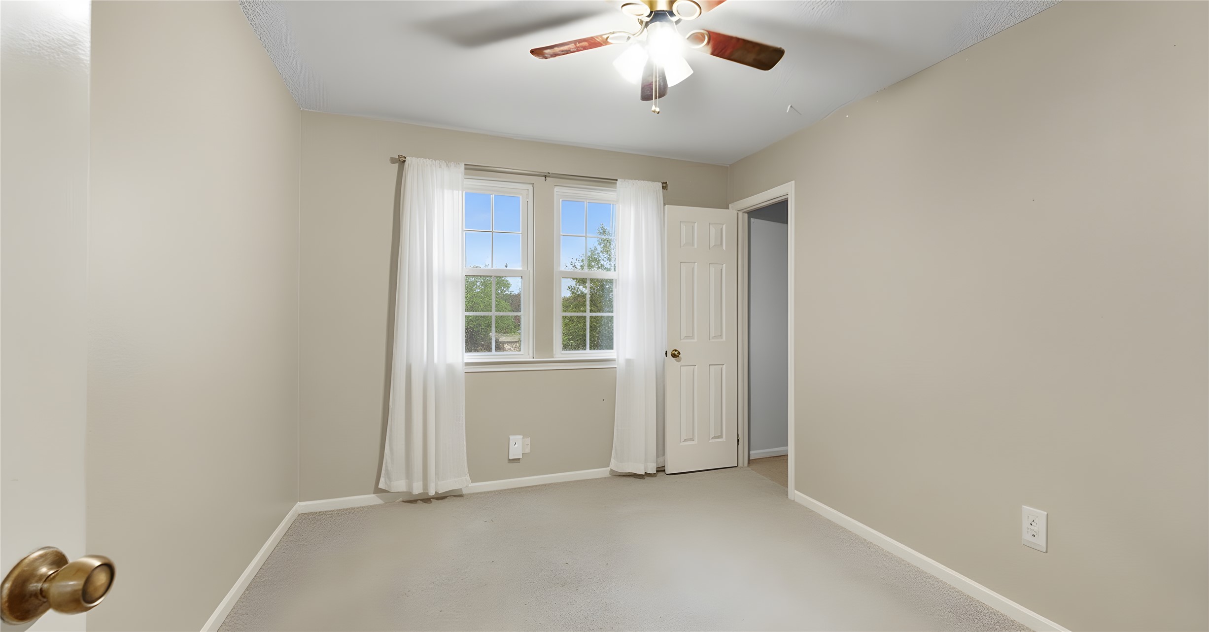 9111 Hazelhurst Drive Austin, TX 78729 - Photo 10 of 13 an empty room with a window