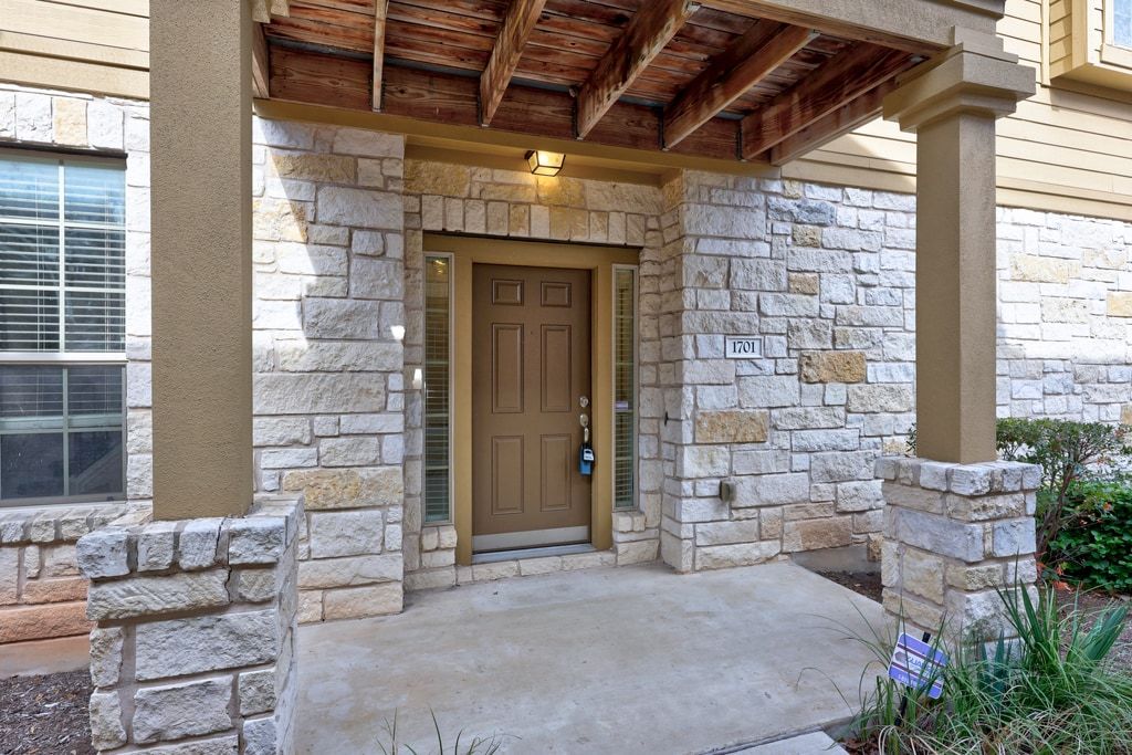 14815 Avery Ranch Boulevard, Unit 1701 Austin, TX 78717 - Photo 2 of 24 a view of an entryway of house with fire pit