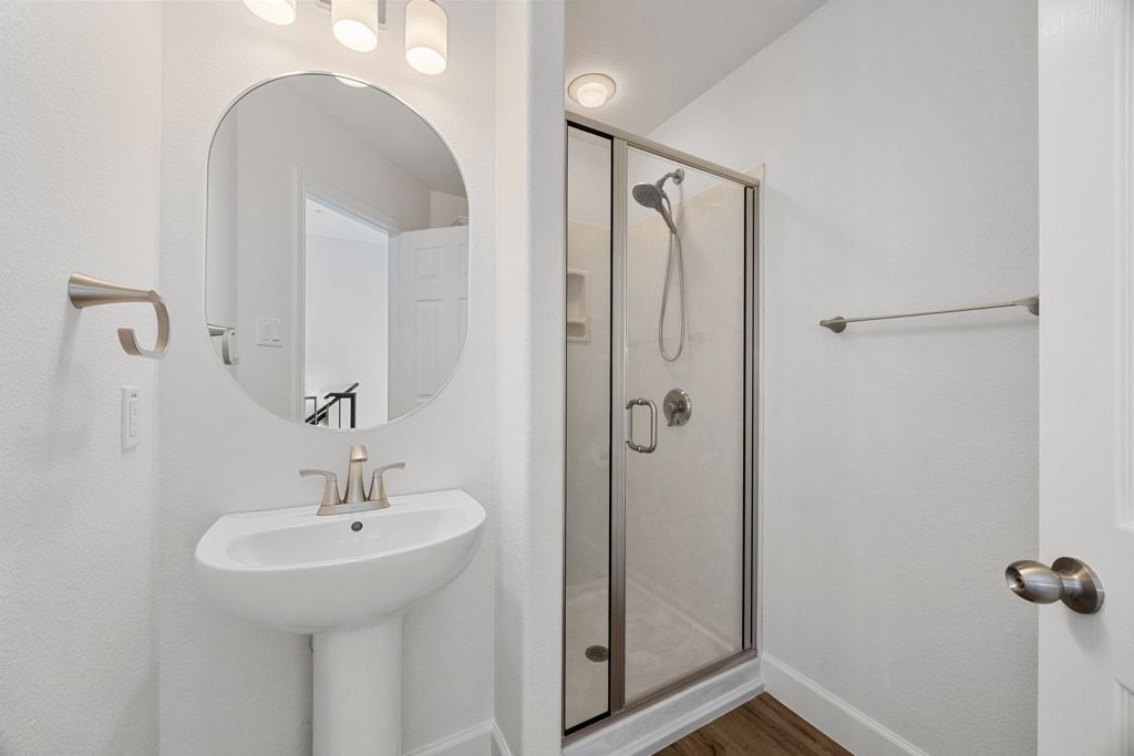 14815 Avery Ranch Boulevard, Unit 1701 Austin, TX 78717 - Photo 5 of 24 a bathroom with a sink a mirror and shower