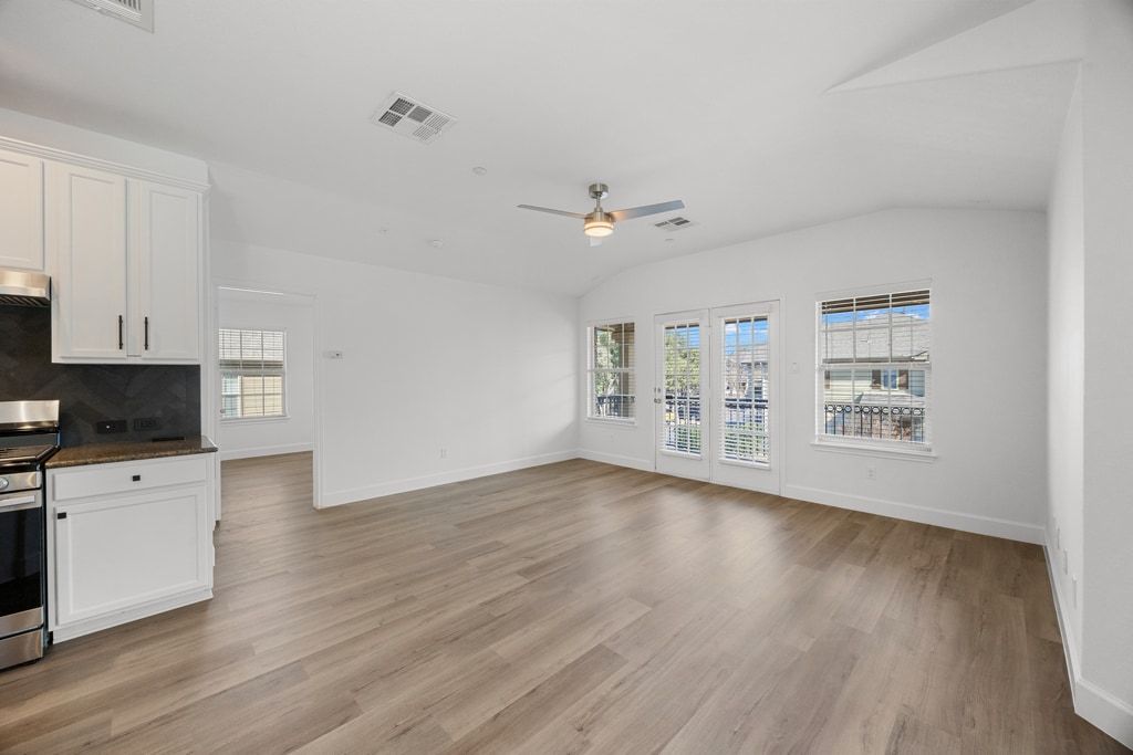 14815 Avery Ranch Boulevard, Unit 1701 Austin, TX 78717 - Photo 6 of 24 a view of an empty room with window and wooden floor