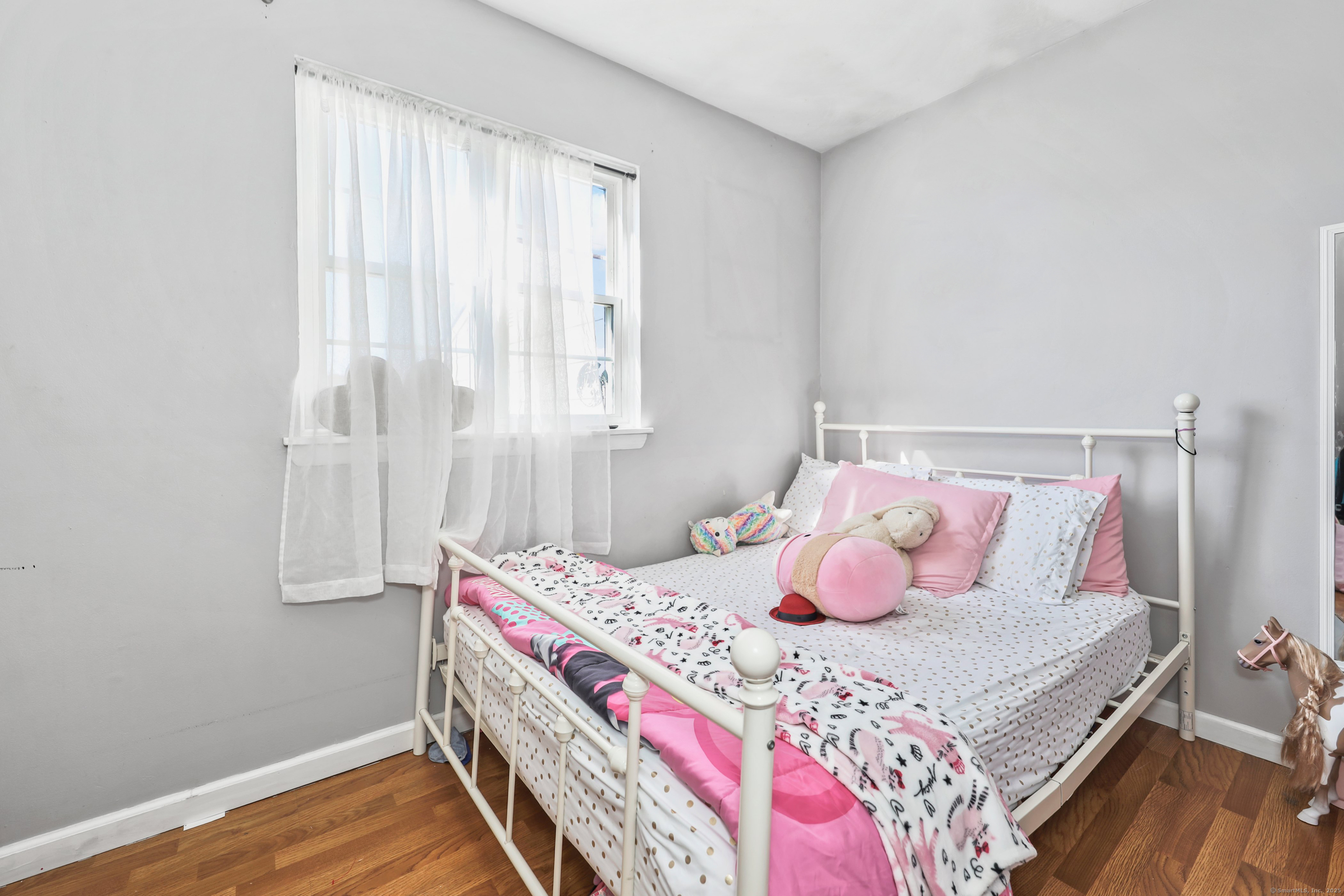 40 Ridge Road, Unit 3 Naugatuck, CT 06770 - Photo 12 of 15 a bedroom with a bed and a window