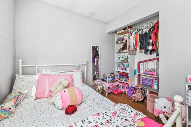 a bedroom with lots of baby toys and a baby crib