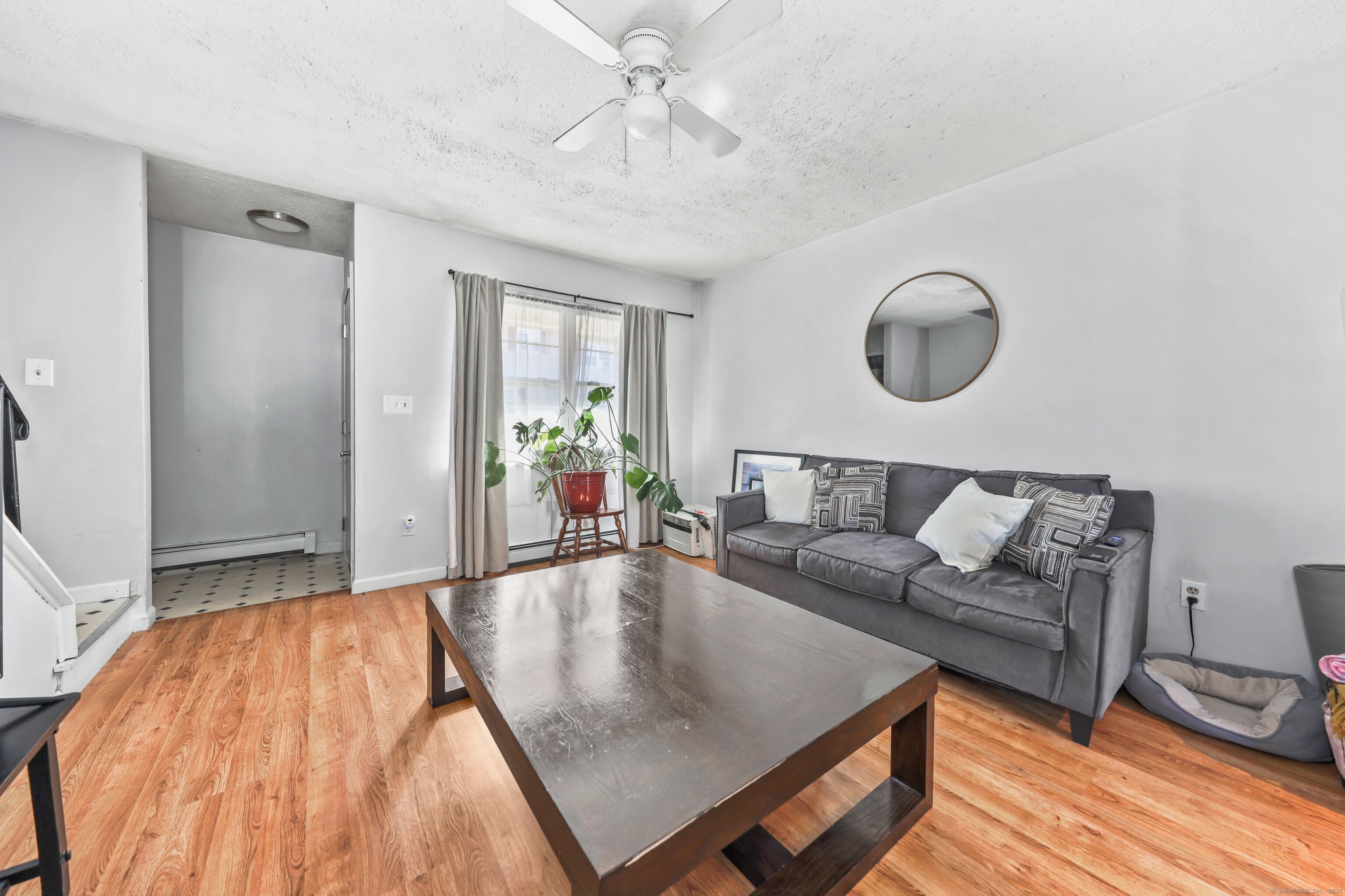 40 Ridge Road, Unit 3 Naugatuck, CT 06770 - Photo 3 of 15 a living room with furniture and a wooden floor