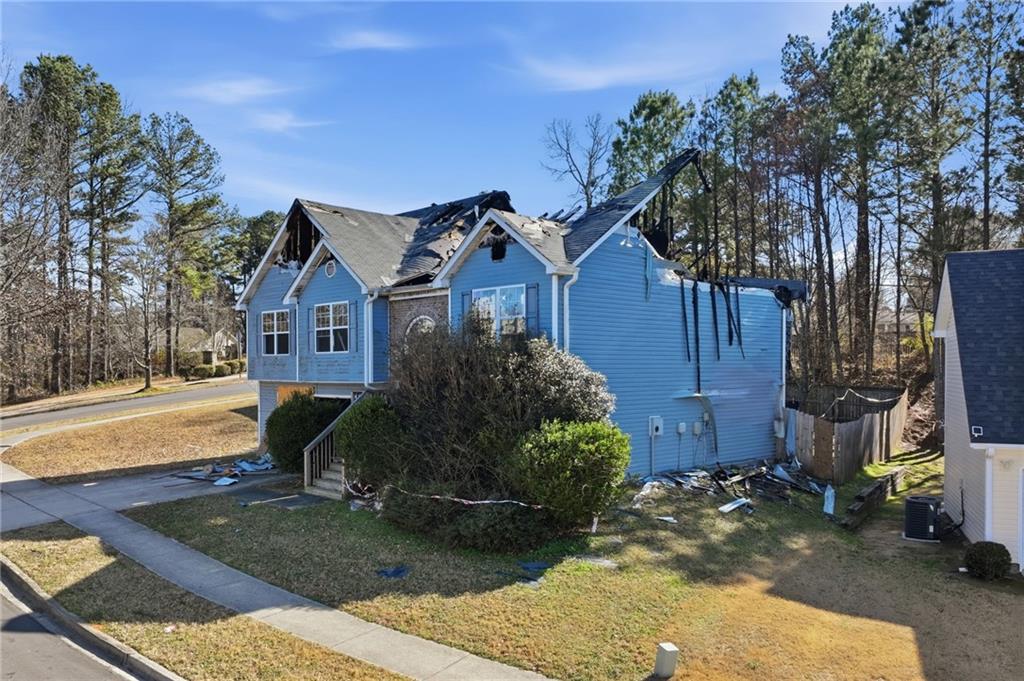 4297 Round Stone Trail Southwest Snellville, GA 30039 - Photo 1 of 1 a front view of a house with garden