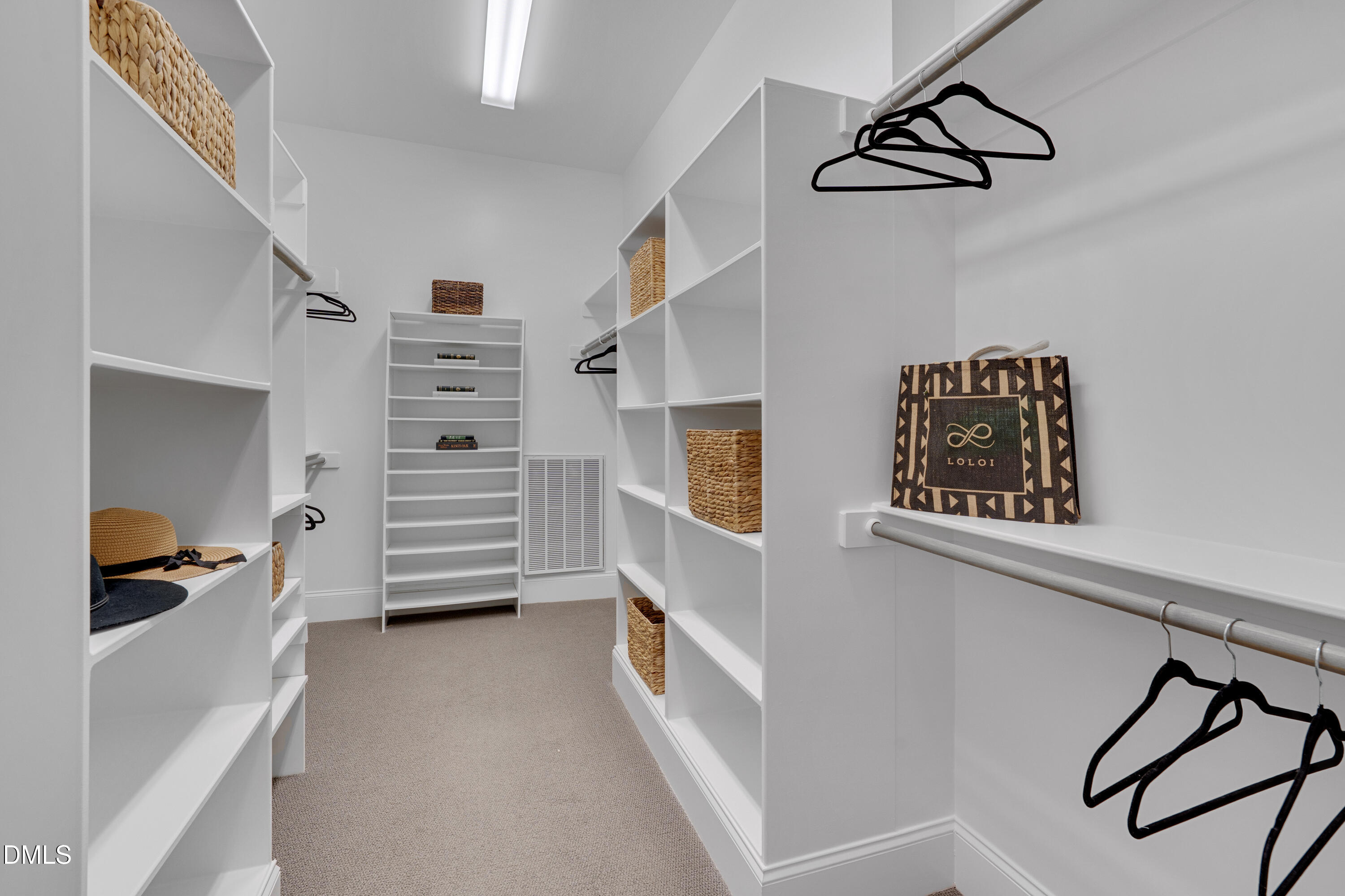8027 Brandyapple Drive Raleigh, NC 27615 - Photo 29 of 52 Large walk-in closet with custom wood shelving