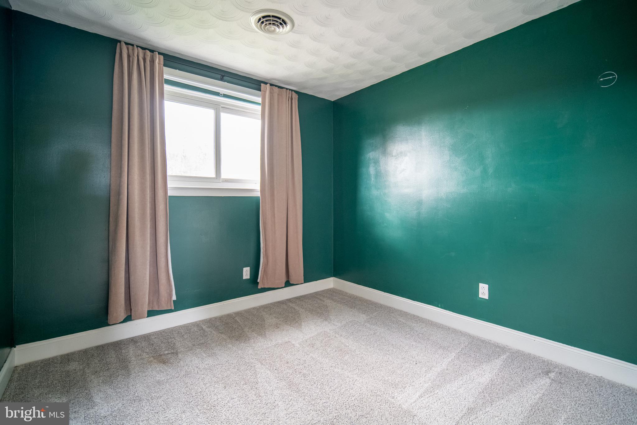 907 Marbrook Lane York, PA 17404 - Photo 14 of 33 a view of a room with a projector and windows