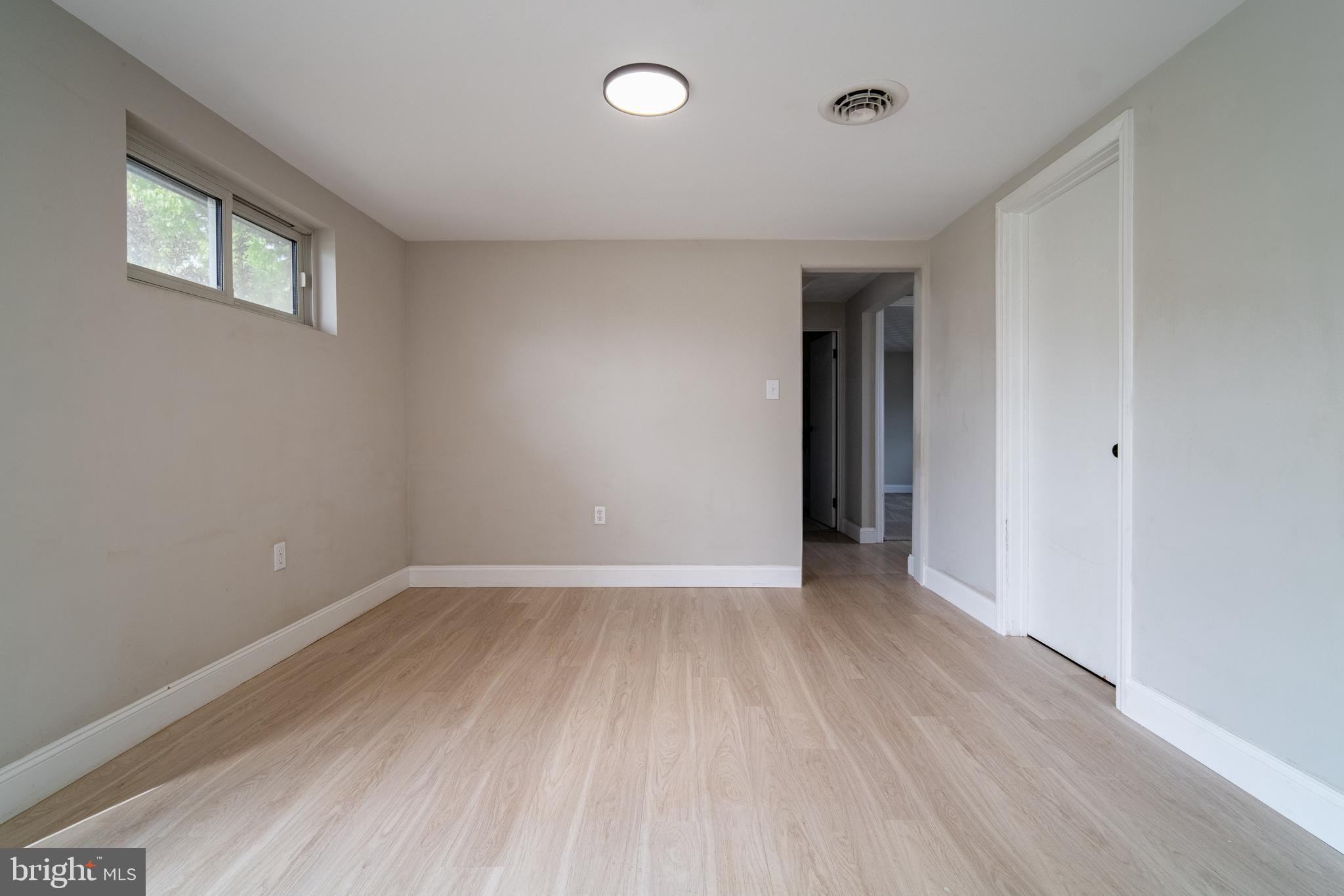 907 Marbrook Lane York, PA 17404 - Photo 28 of 33 wooden floor in an empty room with a window