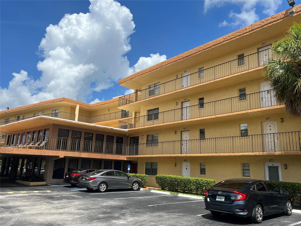 9273 Southwest 8th Street, Unit 419 Boca Raton, FL 33428 - Photo 1 of 8 FRONT OF BUILDING