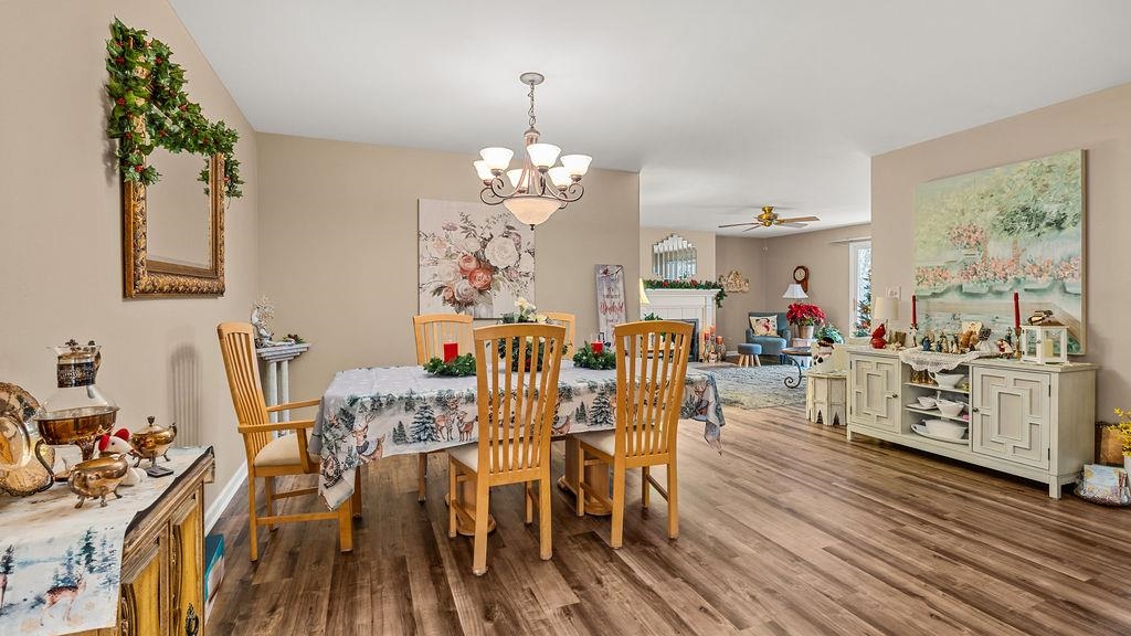 5548 Spring Brook Road, Unit 310 Rockford, IL 61114 - Photo 12 of 41 a view of a dining room with furniture window and wooden floor