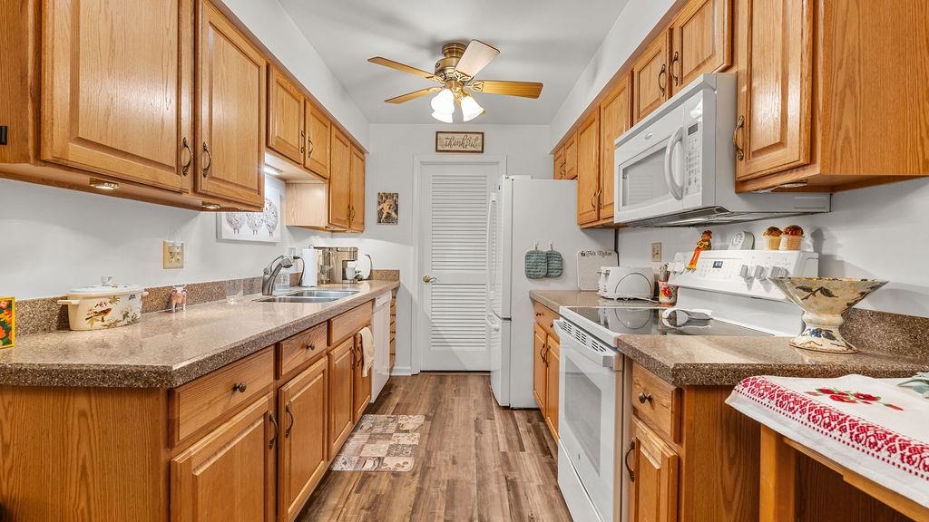 5548 Spring Brook Road, Unit 310 Rockford, IL 61114 - Photo 16 of 41 a kitchen with stainless steel appliances granite countertop a sink a stove and cabinets