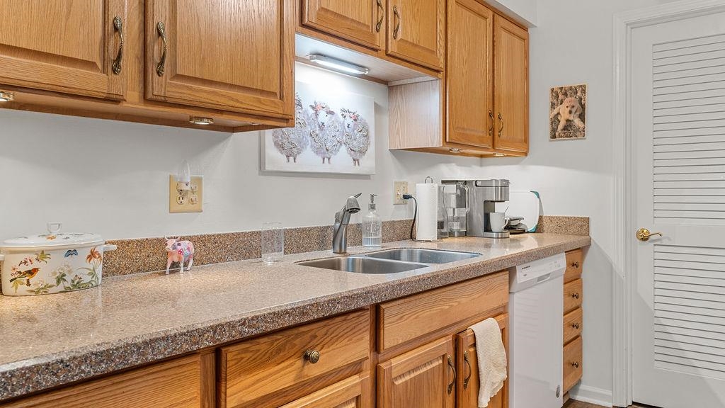 5548 Spring Brook Road, Unit 310 Rockford, IL 61114 - Photo 17 of 41 a kitchen with sink and cabinets
