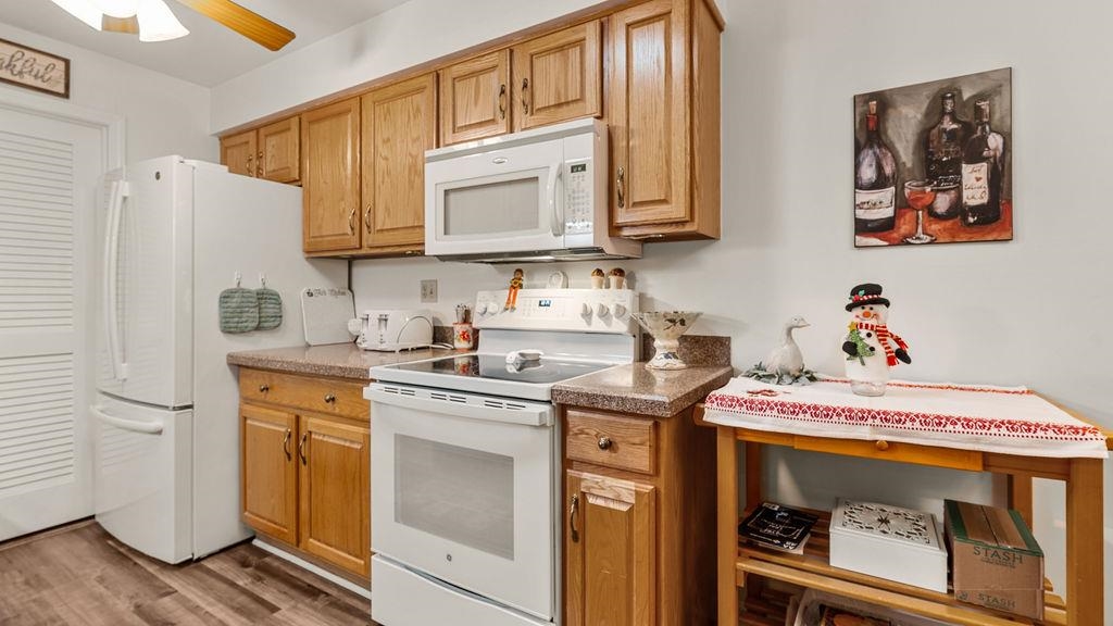 5548 Spring Brook Road, Unit 310 Rockford, IL 61114 - Photo 18 of 41 a kitchen with a sink cabinets and stainless steel appliances