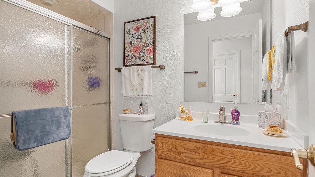 5548 Spring Brook Road, Unit 310 Rockford, IL 61114 - Photo 29 of 41 a bathroom with a sink toilet and shower