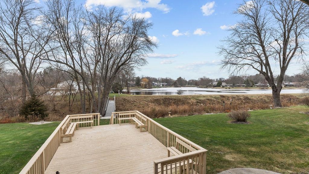 5548 Spring Brook Road, Unit 310 Rockford, IL 61114 - Photo 38 of 41 a view of lake with a yard and trees