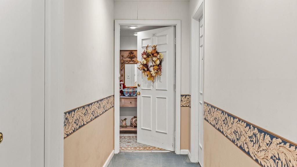 5548 Spring Brook Road, Unit 310 Rockford, IL 61114 - Photo 5 of 41 a view of a hallway with wooden floor and entryway