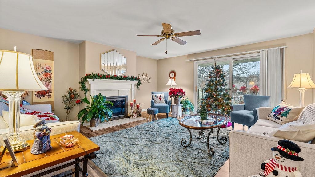 5548 Spring Brook Road, Unit 310 Rockford, IL 61114 - Photo 7 of 41 a living room with furniture and a chandelier
