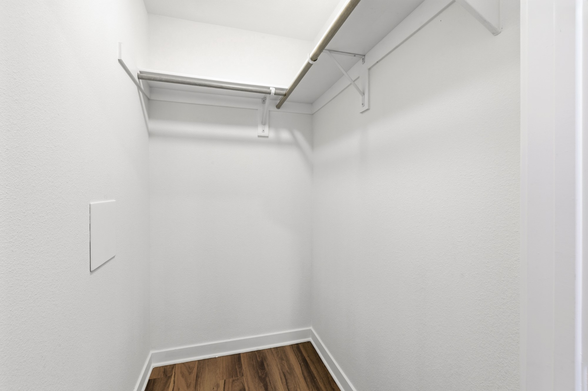 108 Irene Street Elgin, TX 78621 - Photo 16 of 29 Walk in closet featuring dark wood-style floors