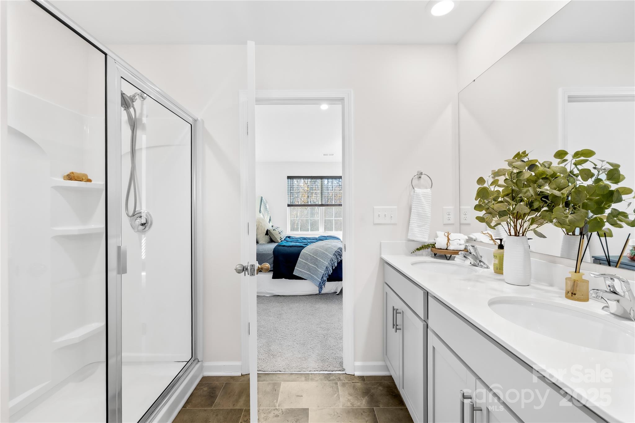 2721 Waybrook Drive Dallas, NC 28034 - Photo 21 of 33 a bathroom with a double vanity sink a mirror and a shower