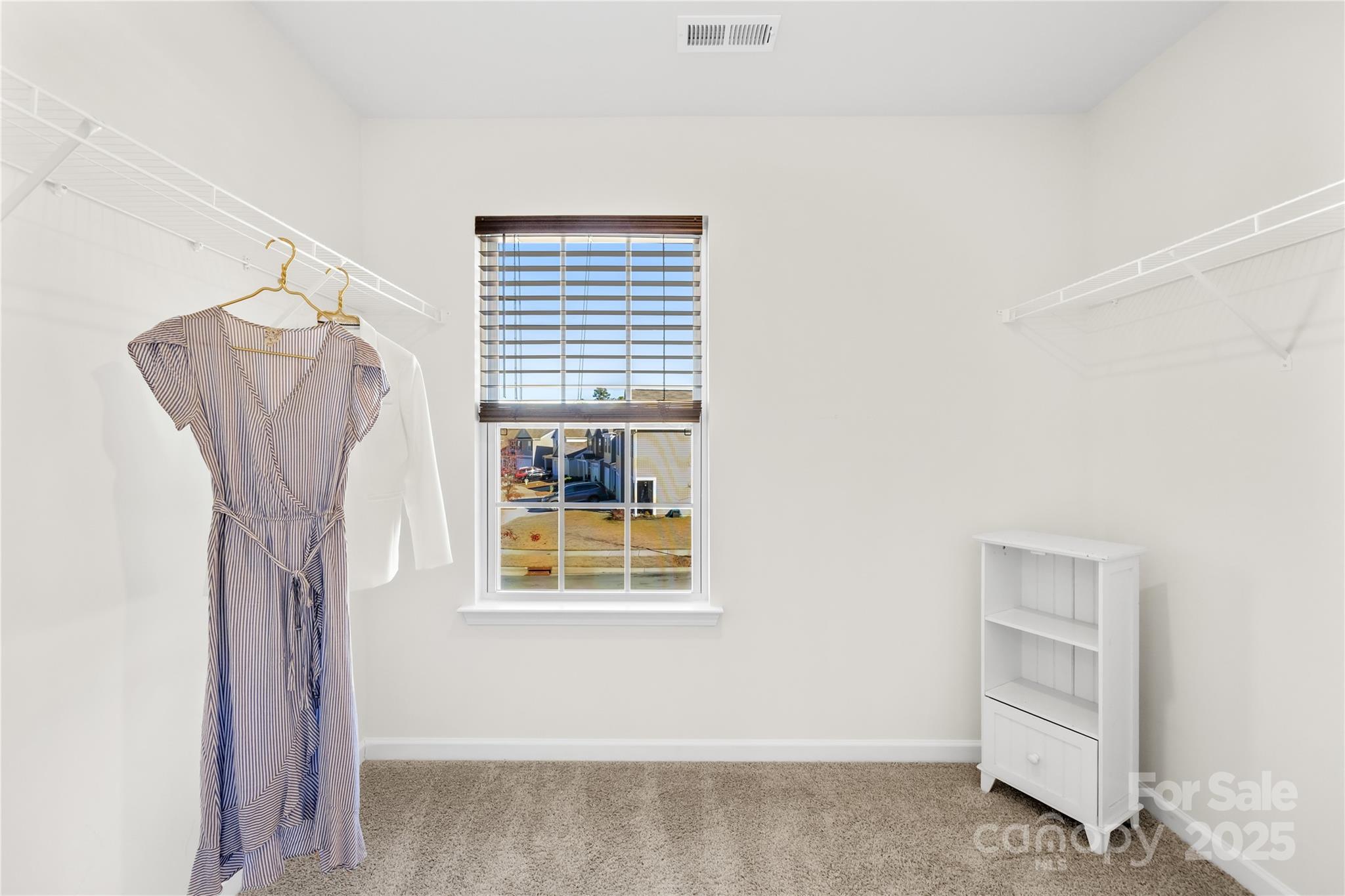 2721 Waybrook Drive Dallas, NC 28034 - Photo 22 of 33 a view of walk in closet with empty racks