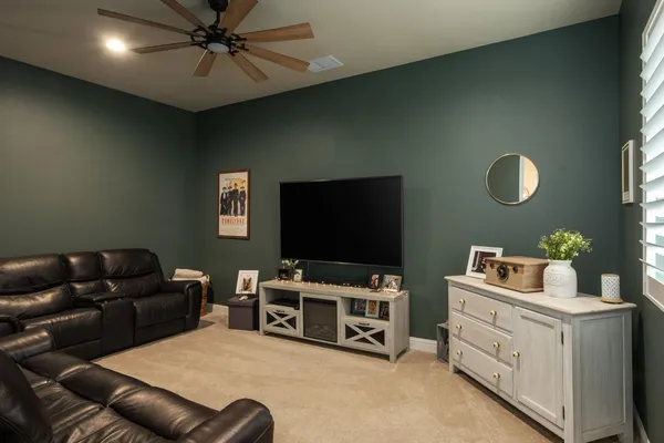 a kitchen with a refrigerator and cabinets