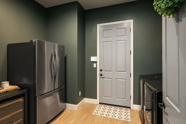 a view of entryway livingroom and hall with wooden floor