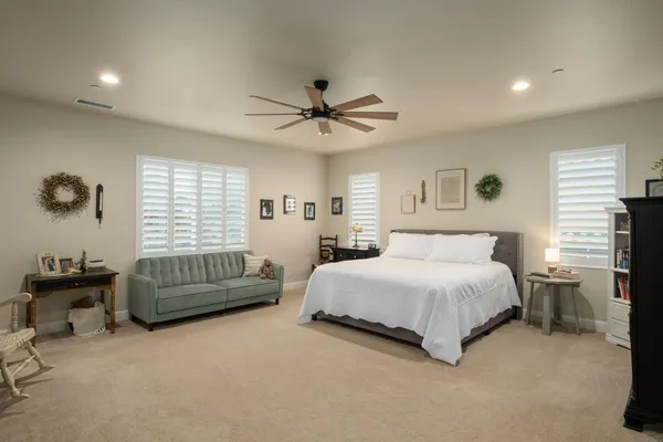 a hall with a sink and a mirror