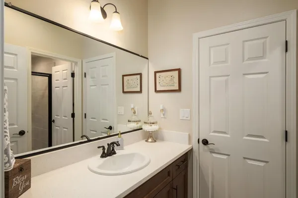 a bedroom with a bed and a table