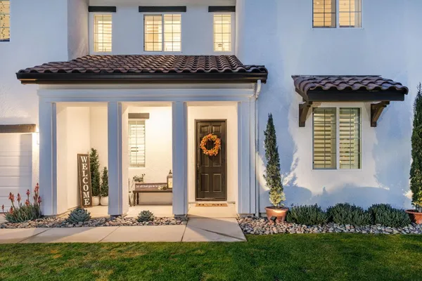 a front view of a house with a yard