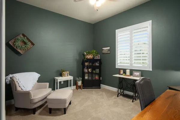 a work room with furniture and a window