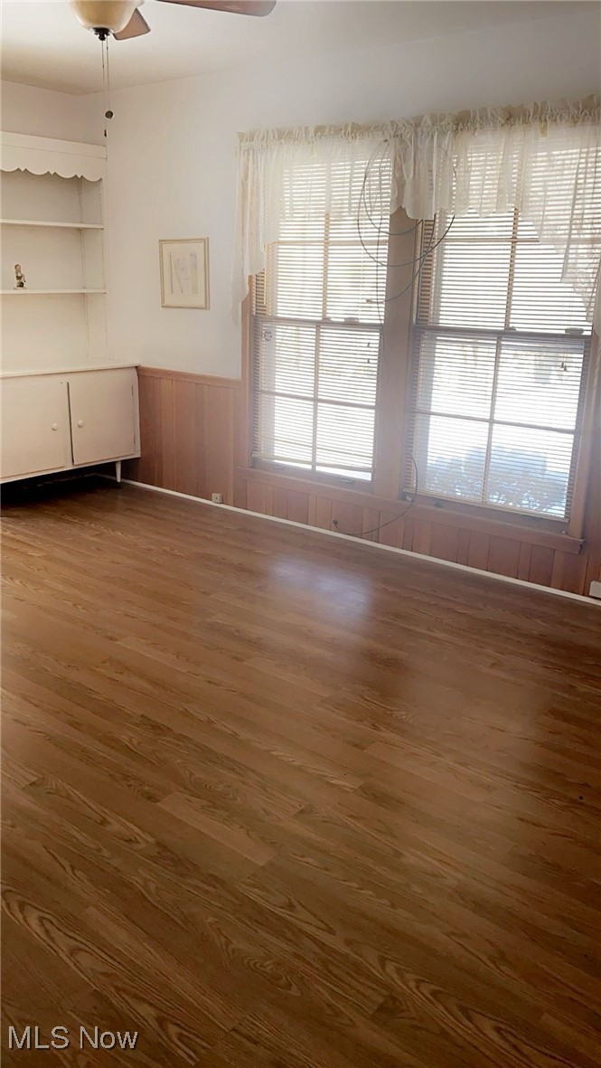 15657 Fenemore Road Cleveland, OH 44112 - Photo 14 of 26 Unfurnished living room with dark hardwood / wood-style floors and ceiling fan
