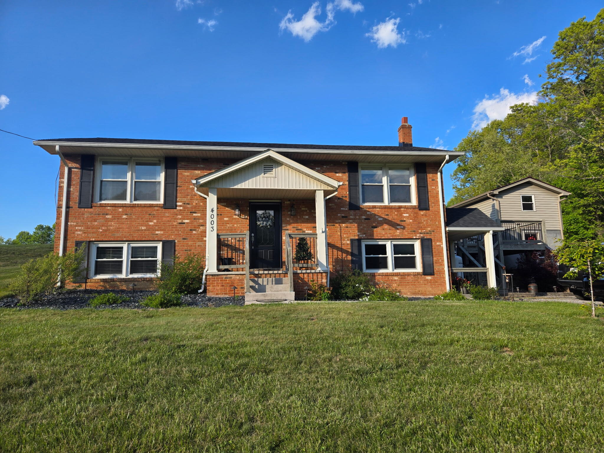4003 Webbs Mill Road North Riner, VA 24149 - Photo 1 of 70 a front view of a house with a yard