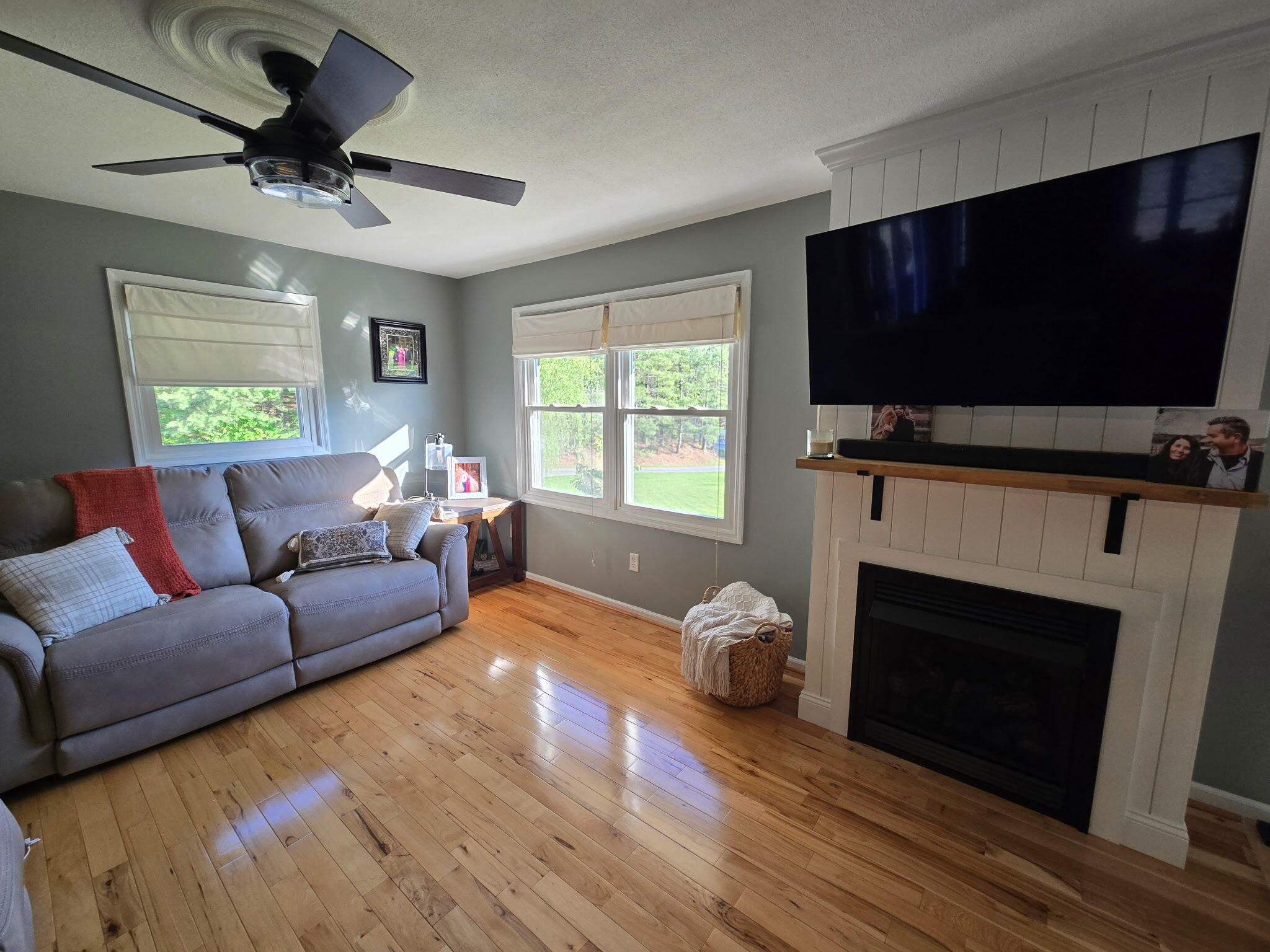 4003 Webbs Mill Road North Riner, VA 24149 - Photo 15 of 70 a living room with furniture a flat screen tv and a fireplace