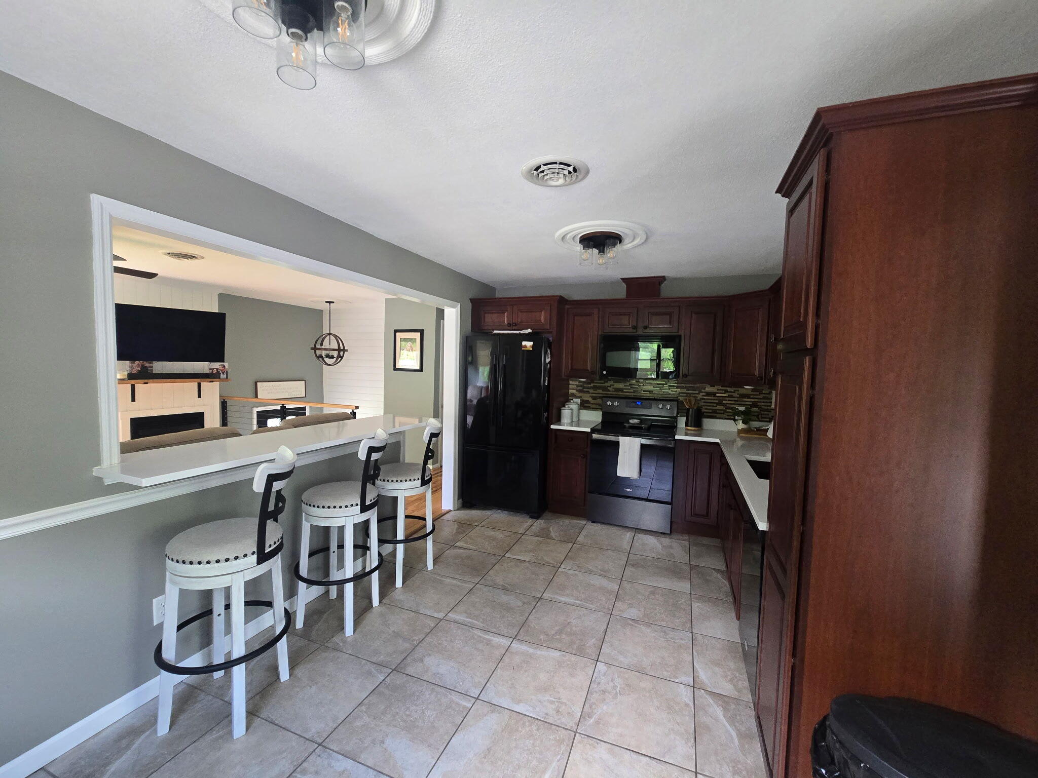 4003 Webbs Mill Road North Riner, VA 24149 - Photo 19 of 70 a kitchen with stainless steel appliances granite countertop a refrigerator and a sink