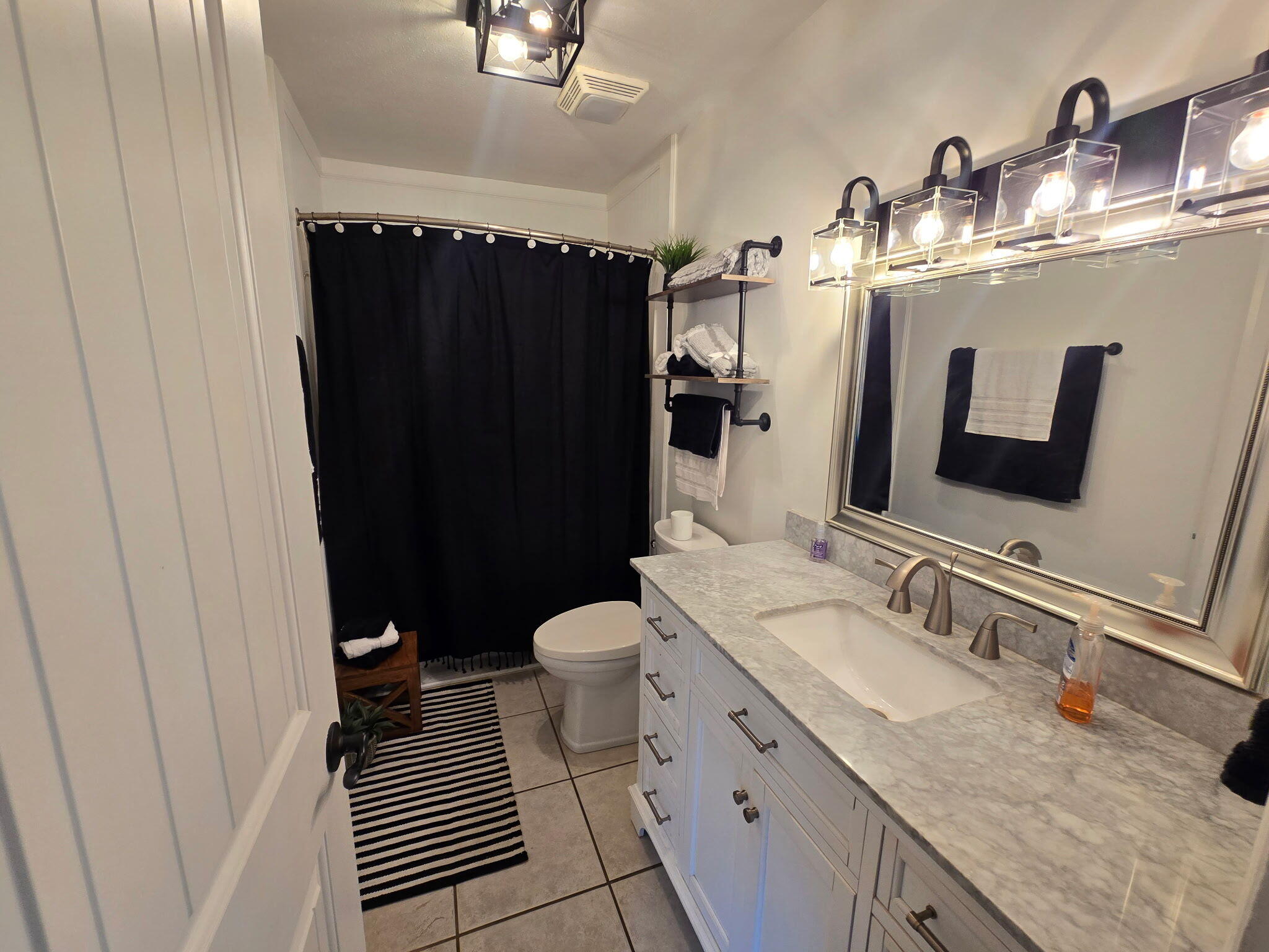 4003 Webbs Mill Road North Riner, VA 24149 - Photo 32 of 70 a bathroom with a granite countertop sink toilet and shower