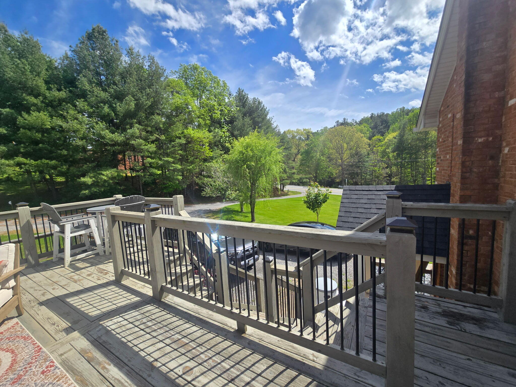 4003 Webbs Mill Road North Riner, VA 24149 - Photo 5 of 70 a view of a wooden deck and a yard with wooden floor