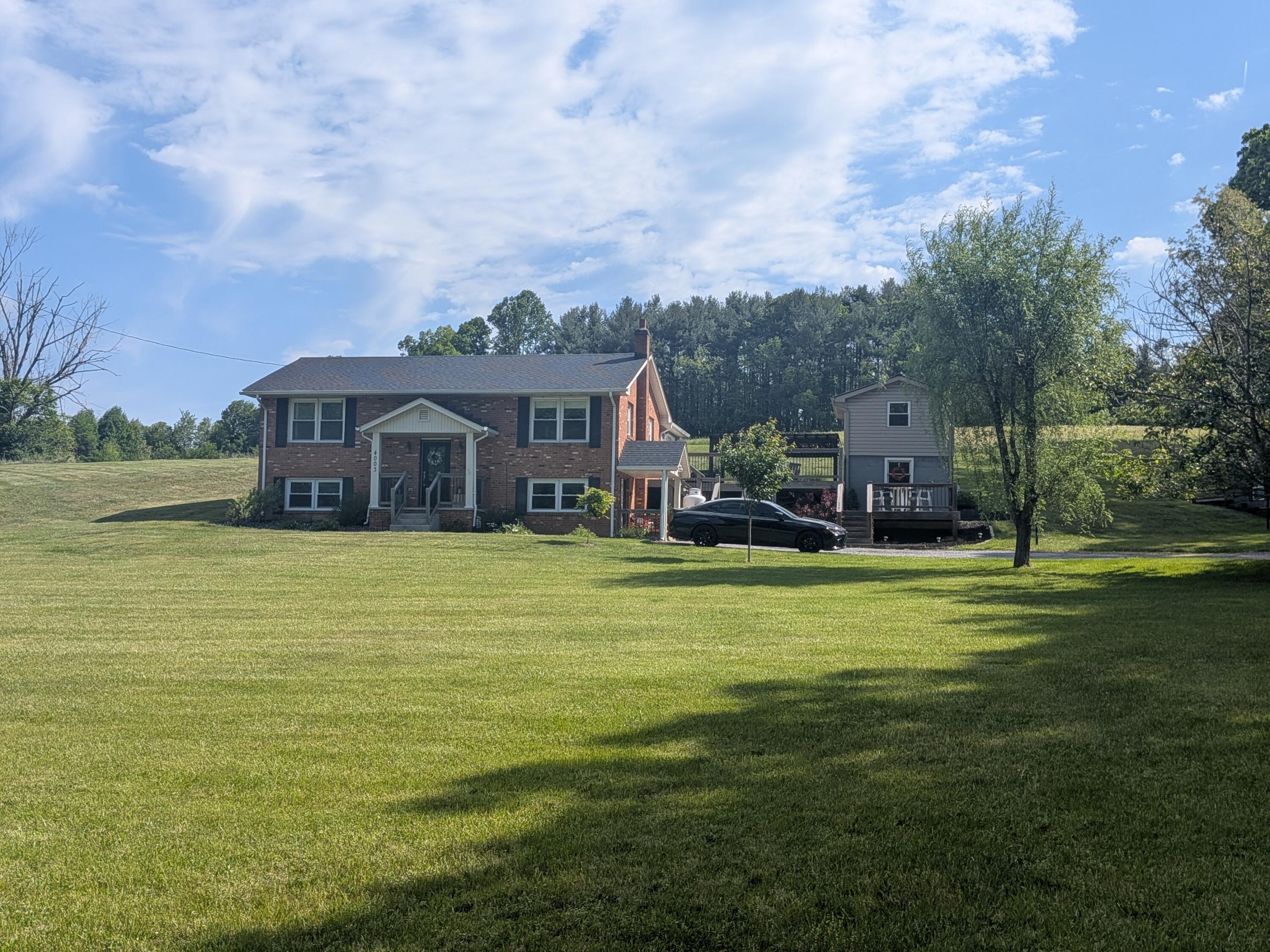 4003 Webbs Mill Road North Riner, VA 24149 - Photo 66 of 70 a front view of a house with a garden